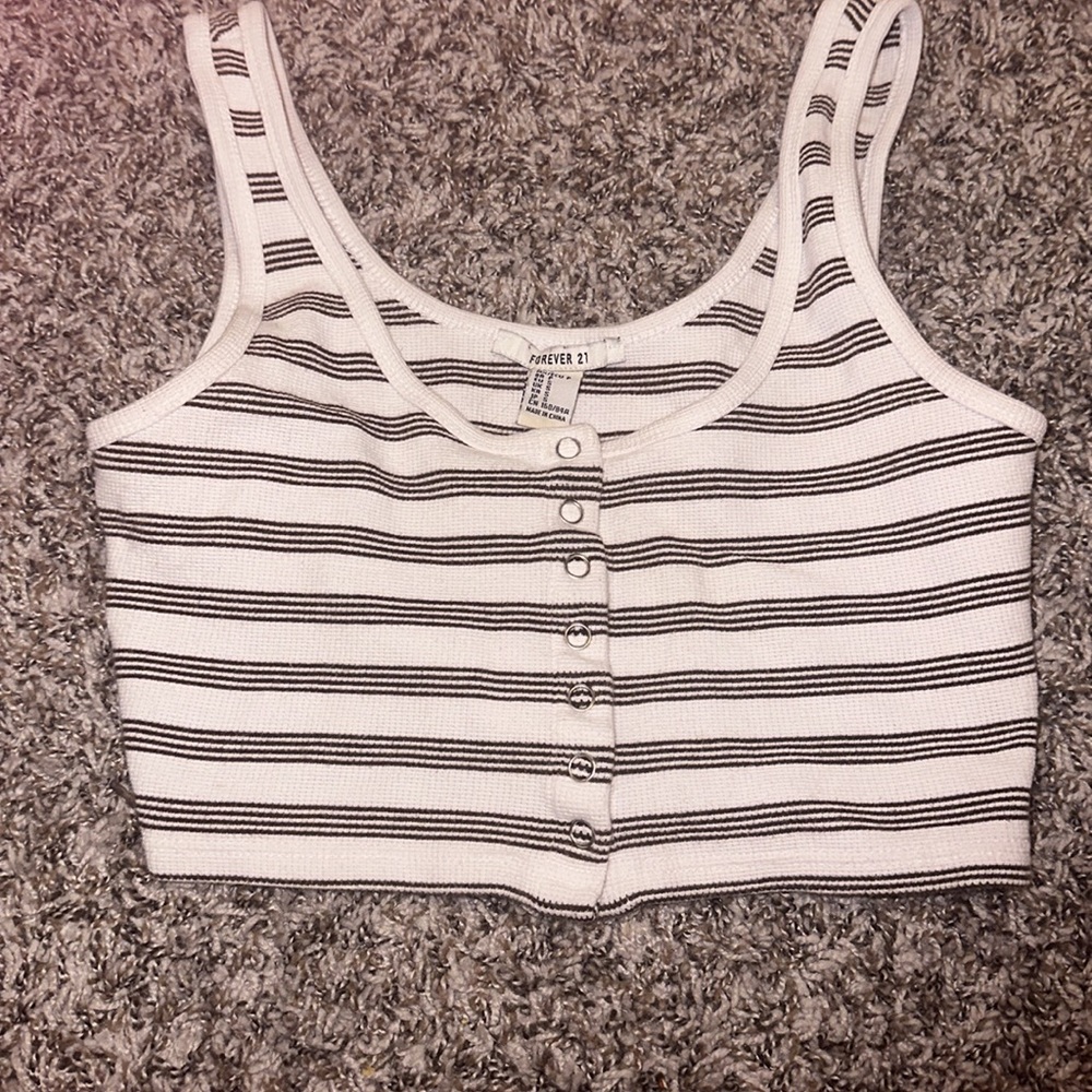 A crop top with snap buttons to get on and off.